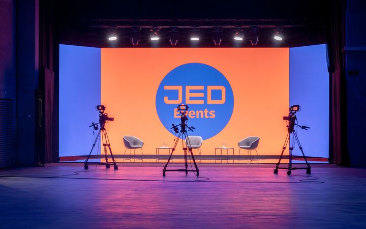 Stage with JED logo at a streaming event in the JED Events hall.